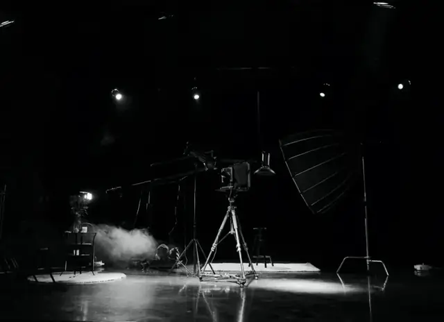 Shixiang’s dark stage, with a large-format camera and lighting at its centre